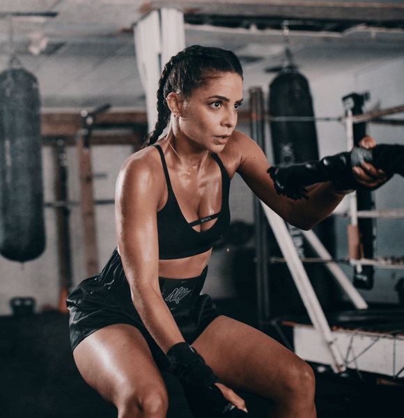 Woman training in a boxing gym.