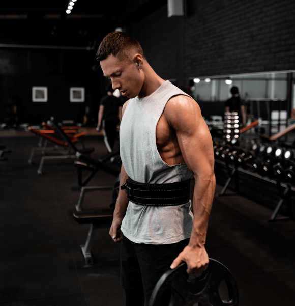 Man lifting weights in a gym.