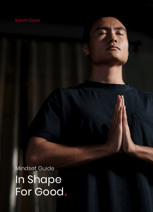Person meditating with hands in prayer position.